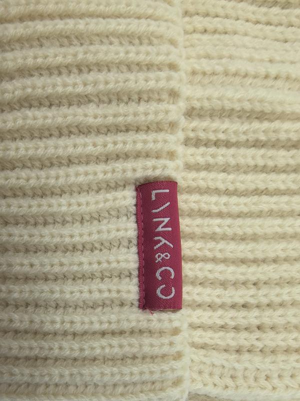 Crème chunky ribgebreide plaid met magenta geweven merklabel - groothandel woonaccessoires
