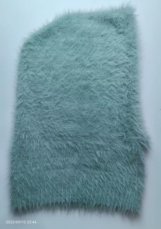 Mintgroene shaggy nepbont gebreide stof staal met lange pool textuur
