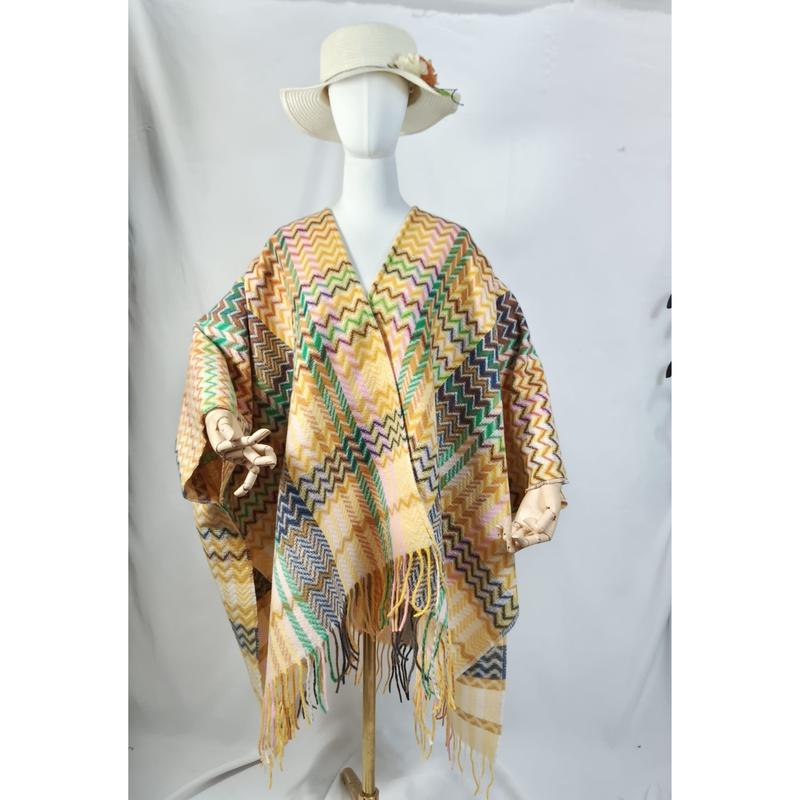 Veelkleurige chevron zigzag poncho wrap met franjes en geweven patroon