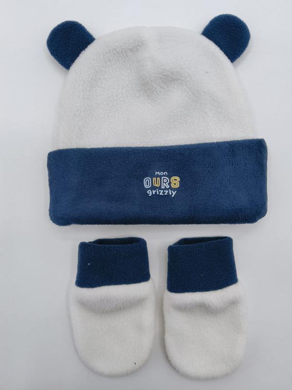 Babymuts met berenoren en bijpassende slofjes in marineblauw en crème