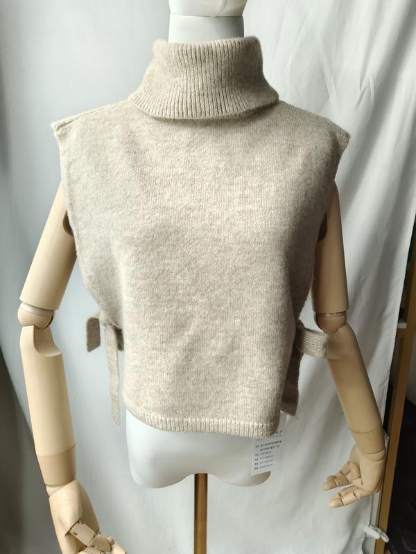Beige mouwloze gebreide col-trui vest met strikdetails aan de zijkanten